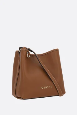 borsa a secchiello GG Emblem mini in pelle liscia