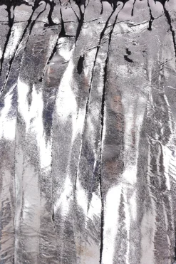 gonna asimmetrica in raso plissé laminato
